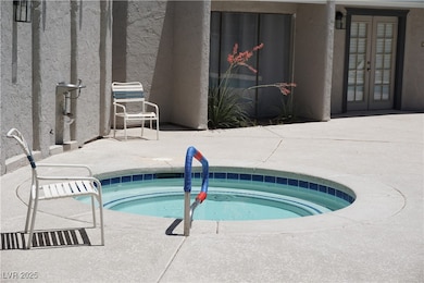 View of swimming pool with a patio area and a comm