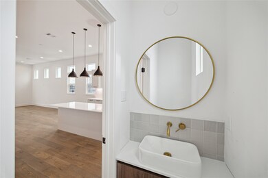 Chic powder room featuring a stylish round mirror,
