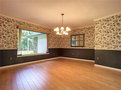 This is a spacious dining room with a pocket made just for a hutch!