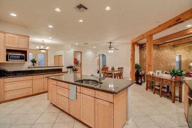 Kitchen view to dining, family room, lau