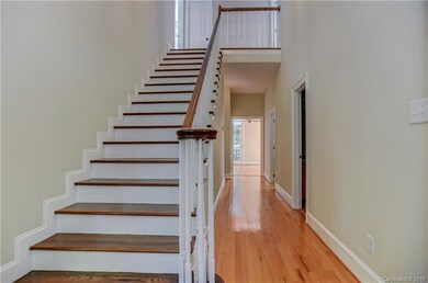 New hardwood staircase with original hardwood bani