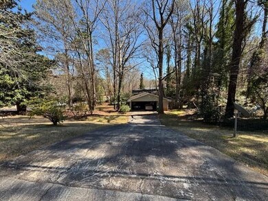 Side of property with 2-car carport