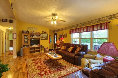 Living room with vaulted ceilings with view down h