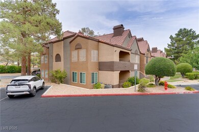 View of property featuring uncovered parking and c