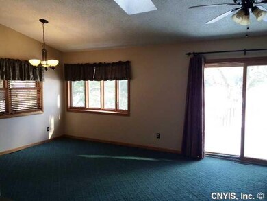 Great Room dining area & family room with sliders 