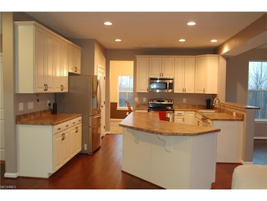 Kitchen w/stainless appliances and new hard wood f