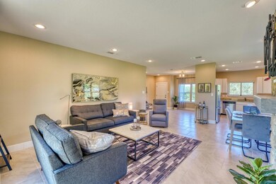 Living area with light tile patterned flooring, b