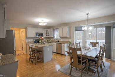 Updated kitchen/dinette with white cabinets and ac