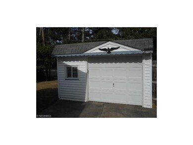 This 1.5 car garage has an electric opener with sa