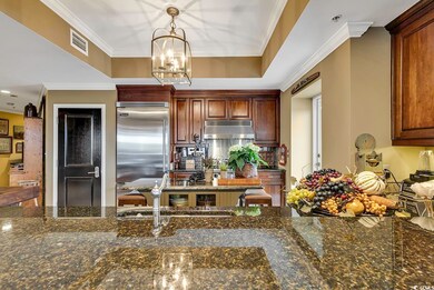 Kitchen with stainless steel built in fridge, crow