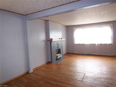 The living room is spacious, has good light, and o