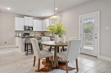 Dining room with recessed lighting and light tile patterned floors