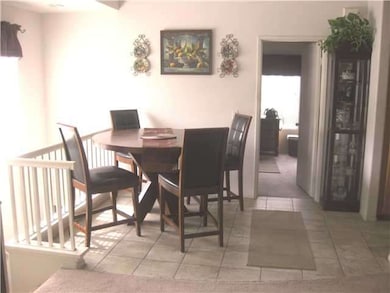 TILE FLOOR LEADS to KITCHENon RIGHT