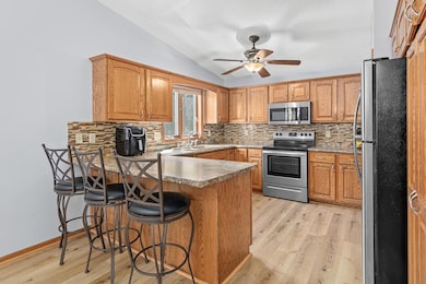Warm and welcoming kitchen with lovely oak cabinets and plenty of storage.