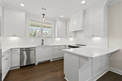 Closer shot of Kitchen with Eating Bar &  Recess L