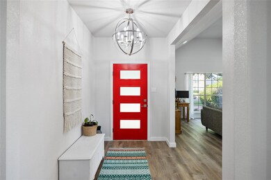 Foyer entrance with hardwood / wood-style flooring