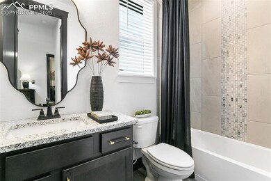 Bathroom with shower / bath combination with curtain and vanity