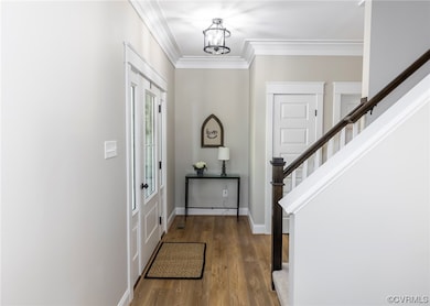 Beautiful Entry with extensive moldings and LVP fl