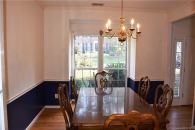 Spacious dining room receives lots of natural ligh