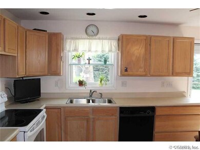 Kitchen. Refrigerator, electric range, built-in di