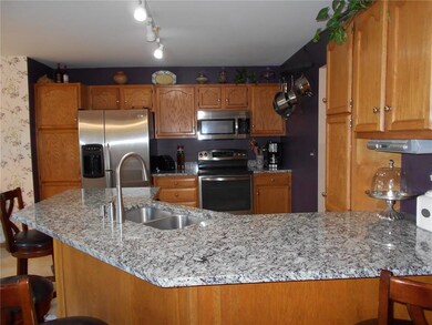 Kitchen has new granite counter tops, stainless st