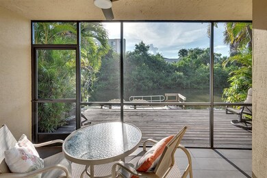 Screened Porch open to deck and steps to community