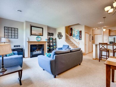 Family room with gas fireplace is light and bright