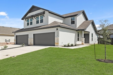 Craftsman house with an attached garage, roof with shingles, and driveway