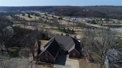 Amazing bluff home in beautiful Bella Vista, over looking Berksdale Golf Course and Sugar Creek Valley.
Just inside the privacy fence is a like new 6x12 storage building built in 2016