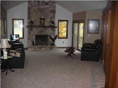 LARGE LIVING AREA WITH VAULTED CEILINGS AND STONE 