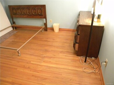 Bedroom with hard wood floors
