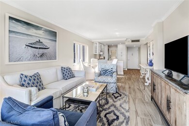 Living room featuring crown molding
