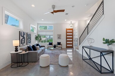 Living area with concrete floors, recessed lighti