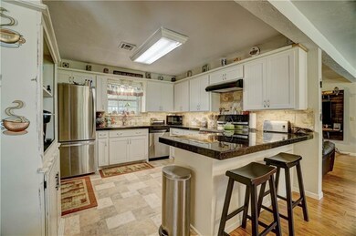 kitchen bar with white cabinets