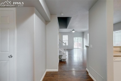 Hall with dark wood finished floors and stairway