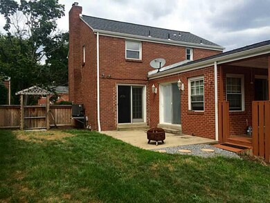 Exterior Back. fenced in yard, patio, covered deck