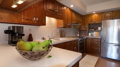 Staged: OMG, a kitchen of your dreams featuring S/S appliances, stunning countertops, and absolutely stunning cabinetry.
