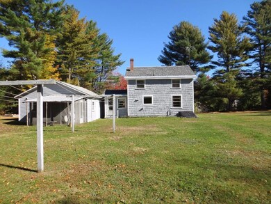 Back yard of house with garage and...