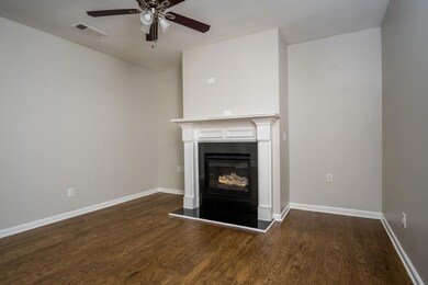 Unfurnished living room featuring visible vents, b