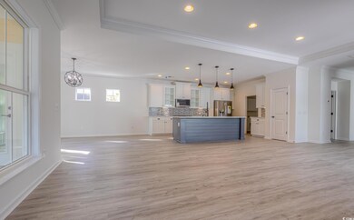 Kitchen with decorative light fixtures, a center i