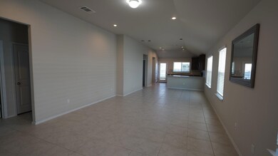 Spare room with recessed lighting, light tile patterned floors, and lofted ceiling