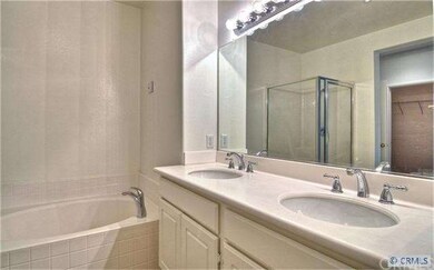 Master bath with dual sink, tub and separate showe