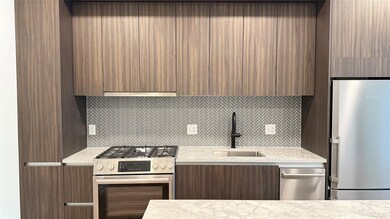 Kitchen with stainless steel appliances, modern c