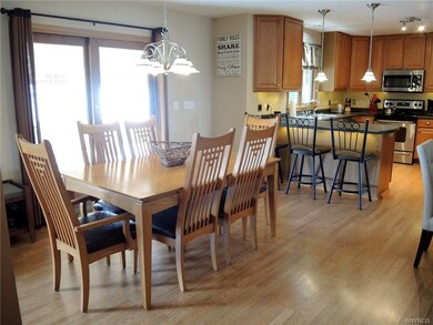 Sliding glass door in kitchen that goes out to 2 t