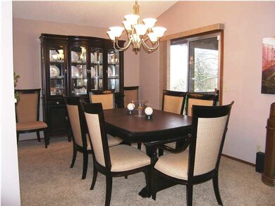 The formal dining has a stunning chandelier and ac