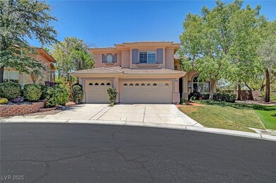 Mediterranean / spanish-style house featuring driveway, a tile roof, a front lawn, stucco siding, and a garage