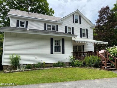 back of house with deck