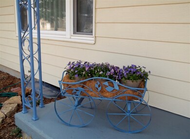 The covered porch has been recently refinished.
