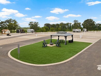 Surrounding community featuring a gazebo, a lawn, and a patio area