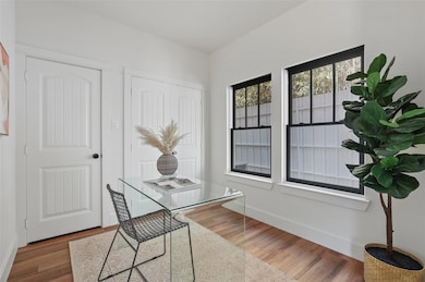 Office space featuring hardwood / wood-style floor